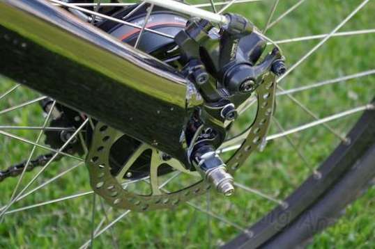 The rear brake. To avoid later squealing, the bike's manual advises a set routine of increasingly firm stops to seat the pads.